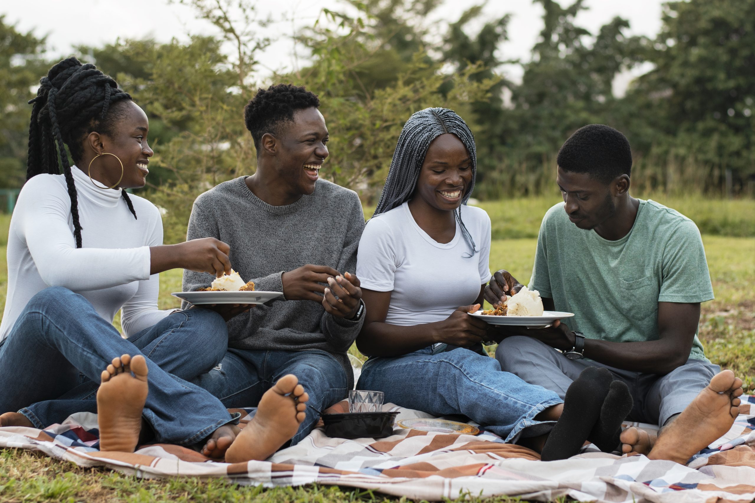 full-shot-smiley-people-with-delicious-food